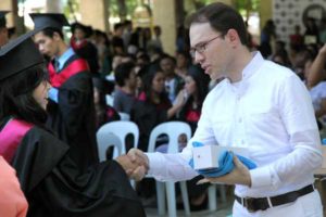 Mr. Roland Flouquet-Vilboux rewarding a graduate