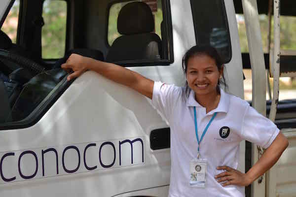 PNC student standing in front of the truck donated by Econocom.