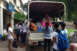 Unloading personal belongings in PN Cambodia's student boarding house with PNC truck
