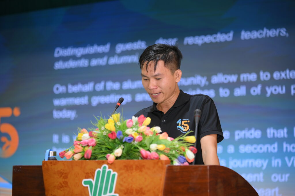 Mr. Huynh Van Nhan, alumnus of the 2011–2013 cohort, speaking at the anniversary celebration.